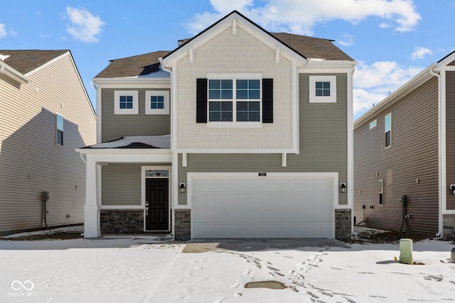 craftsman-style house with stone siding and an attached garage