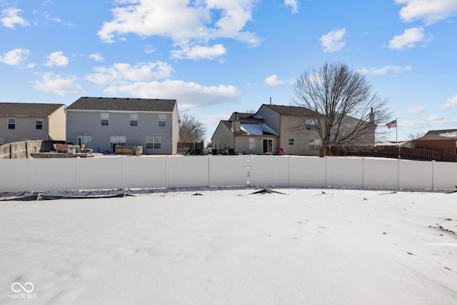 view of yard featuring a residential view and fence