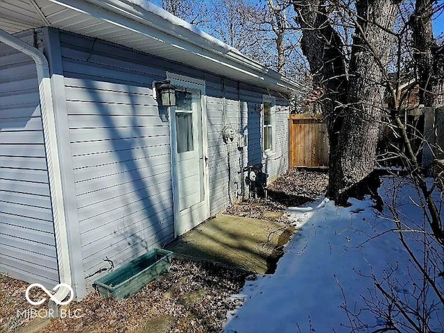 view of home's exterior with fence
