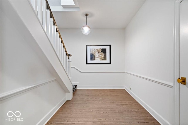 staircase featuring hardwood / wood-style floors