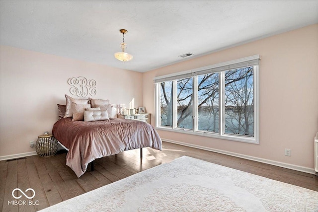 bedroom with hardwood / wood-style floors