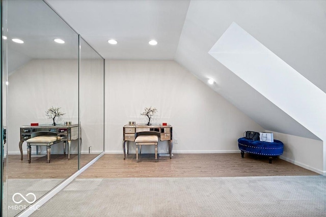 bonus room featuring carpet flooring and lofted ceiling