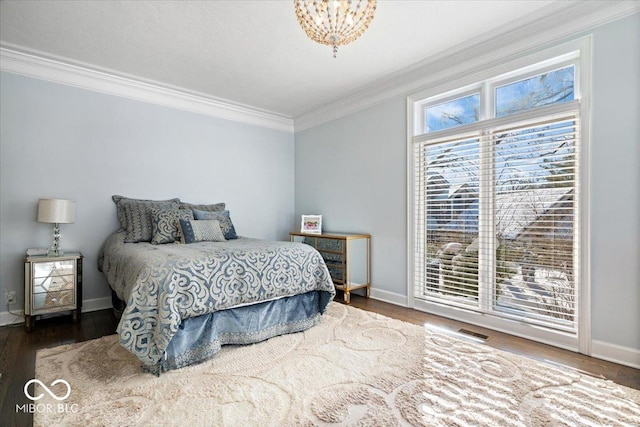 bedroom featuring access to exterior, wood-type flooring, and ornamental molding