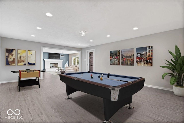 game room with hardwood / wood-style floors and pool table