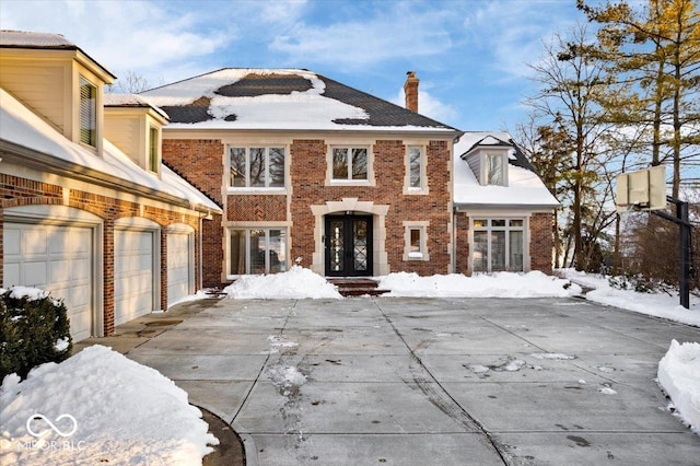 view of front of home featuring a garage and french doors