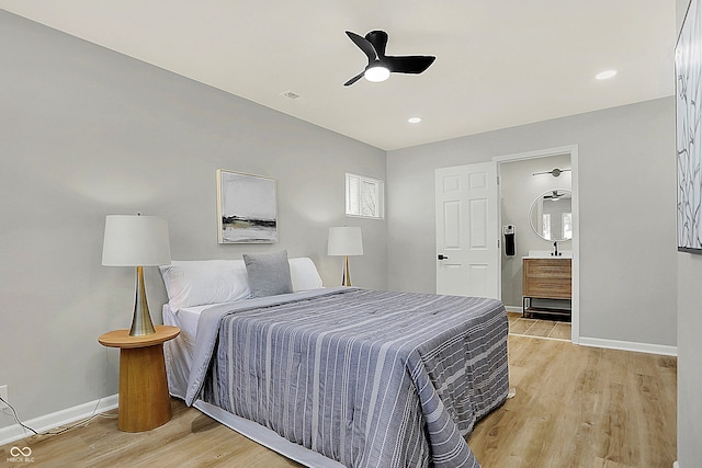 bedroom with ceiling fan and light hardwood / wood-style floors