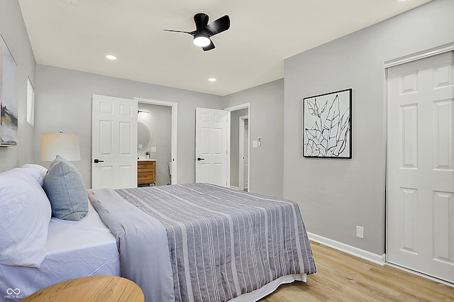 bedroom with ceiling fan and light wood-type flooring