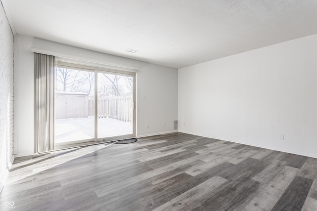 spare room featuring hardwood / wood-style flooring