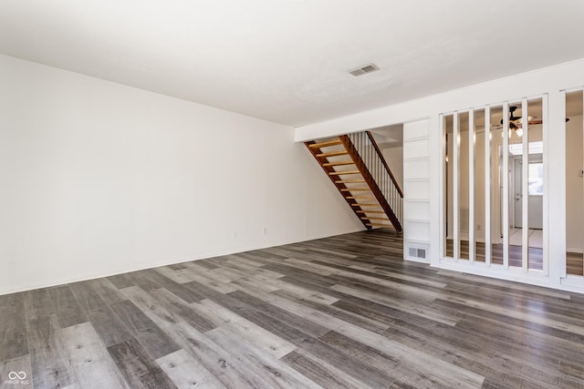 spare room with dark wood-type flooring