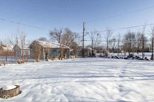 view of yard covered in snow