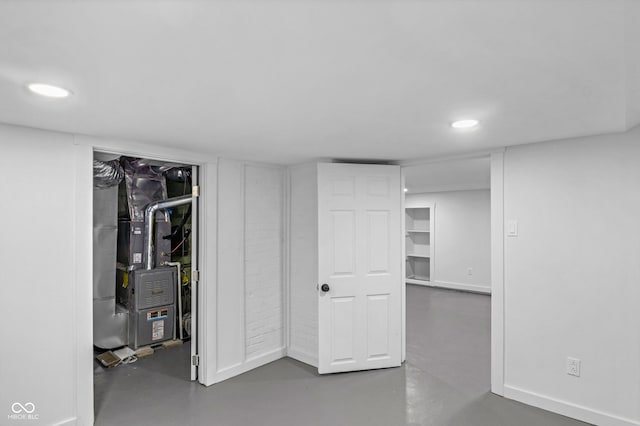 basement featuring heating unit