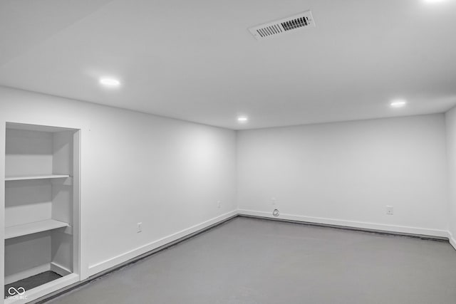 spare room with concrete flooring