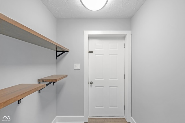 interior space with a textured ceiling