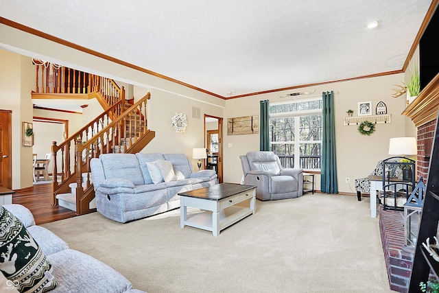 living room featuring a textured ceiling, carpet floors, and ornamental molding