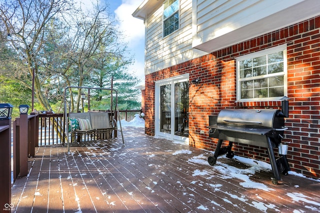 wooden terrace with area for grilling