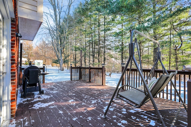 snow covered deck with area for grilling