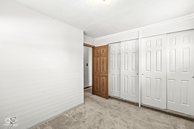 unfurnished bedroom featuring light colored carpet