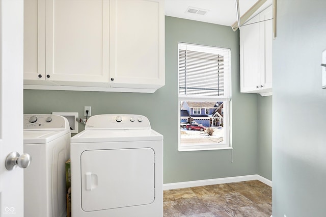 laundry area with cabinets and independent washer and dryer