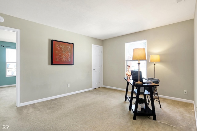 office area featuring light colored carpet