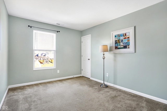 empty room featuring carpet floors