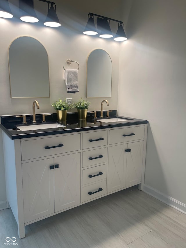 bathroom featuring hardwood / wood-style flooring and vanity