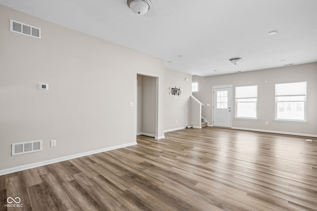 unfurnished living room with hardwood / wood-style flooring