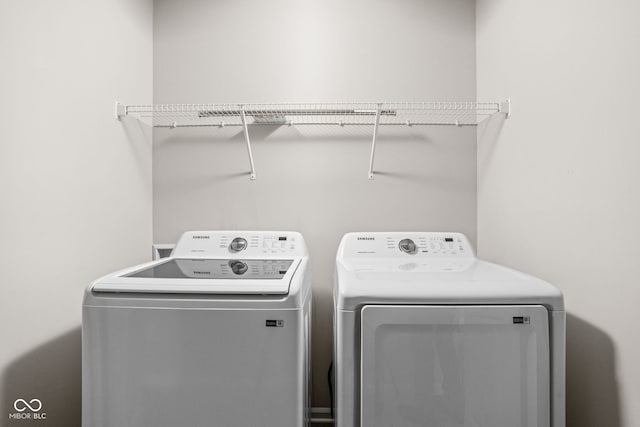 washroom with washer and dryer