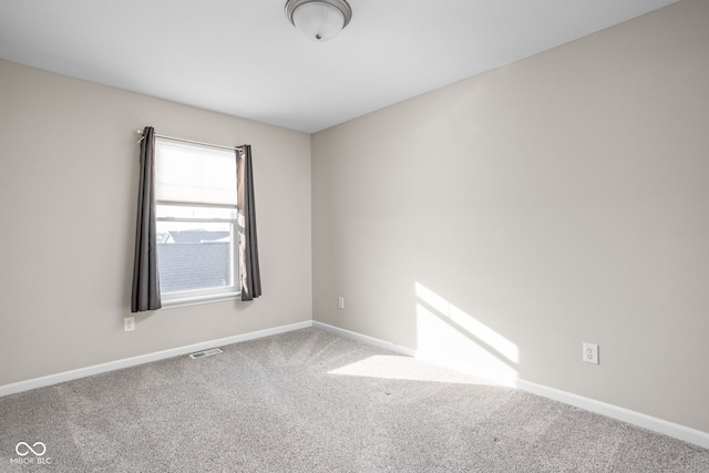 spare room featuring carpet floors