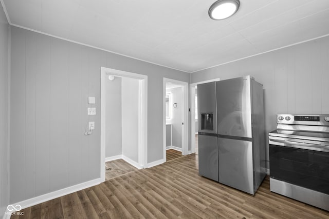 kitchen featuring hardwood / wood-style floors and stainless steel appliances