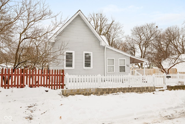 view of snow covered house