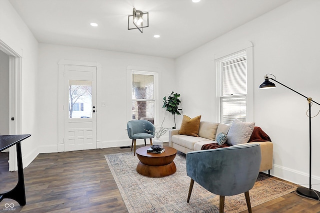 living room with dark hardwood / wood-style floors