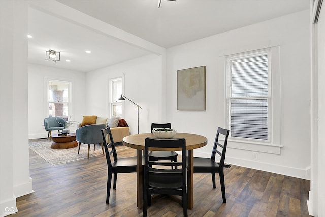 dining area with dark hardwood / wood-style flooring