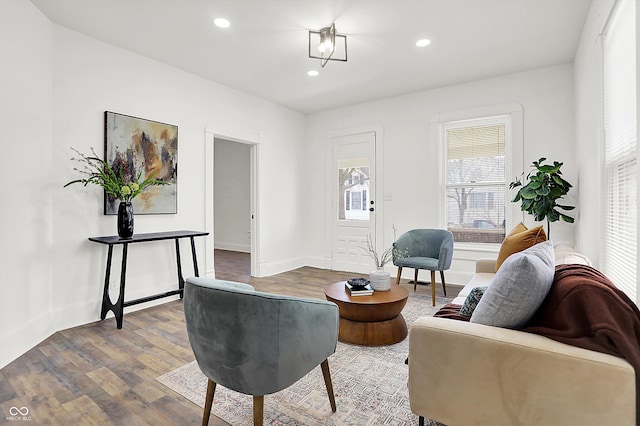 living area with hardwood / wood-style flooring