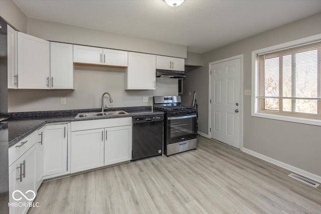 kitchen featuring dishwasher, white cabinets, stainless steel gas range oven, and sink