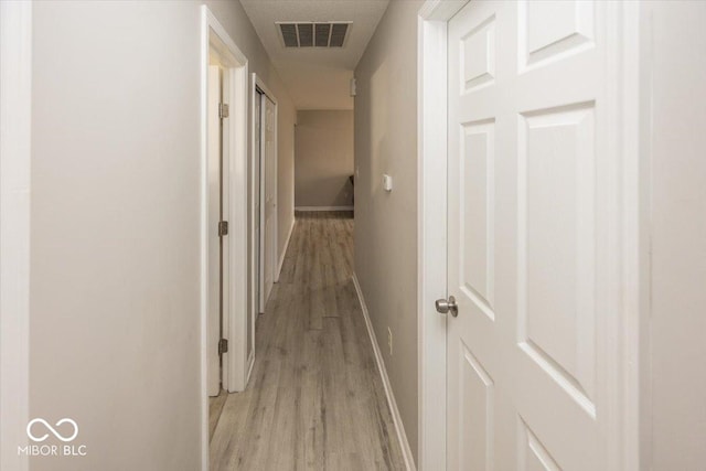 corridor featuring light wood-type flooring