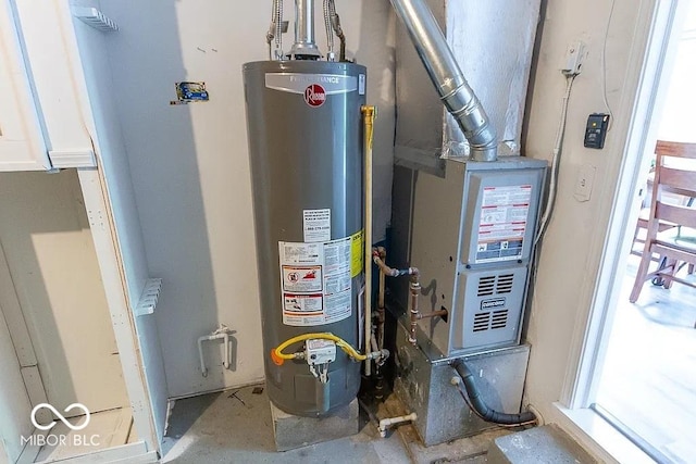 utility room with gas water heater