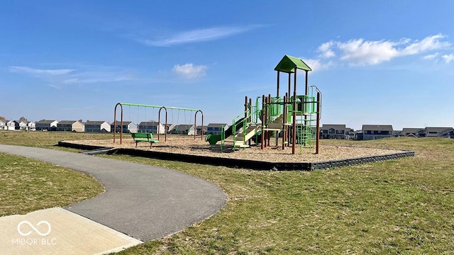 view of jungle gym with a lawn