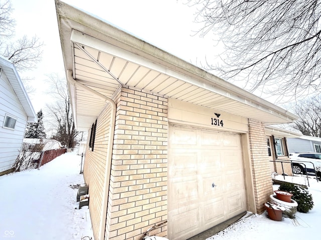 view of snow covered garage