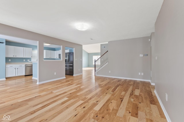 unfurnished living room with light wood-type flooring