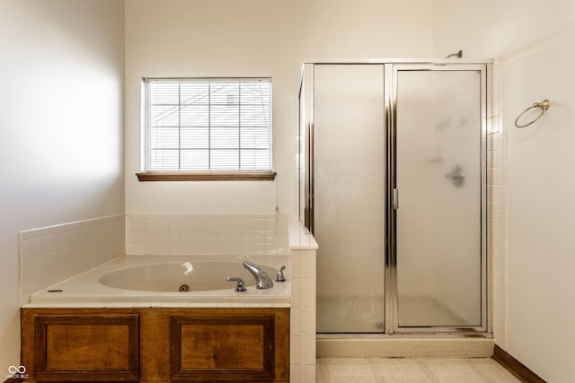 bathroom with a tub with jets and a shower stall