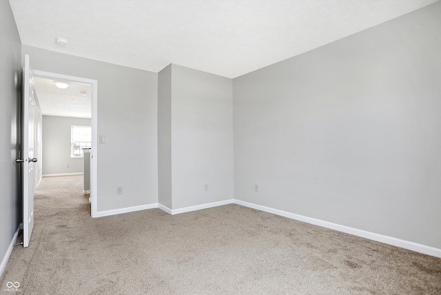 empty room with light colored carpet