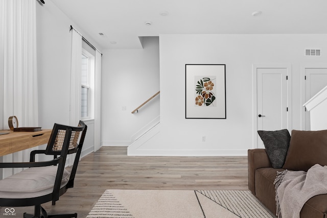 living room with light hardwood / wood-style floors