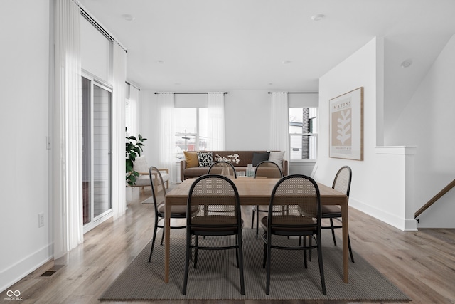 dining room with light hardwood / wood-style flooring