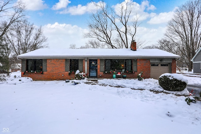 ranch-style home featuring a garage