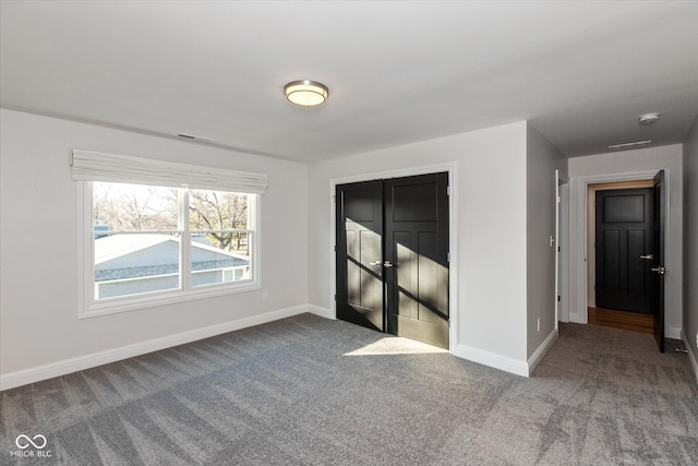 spare room featuring carpet floors