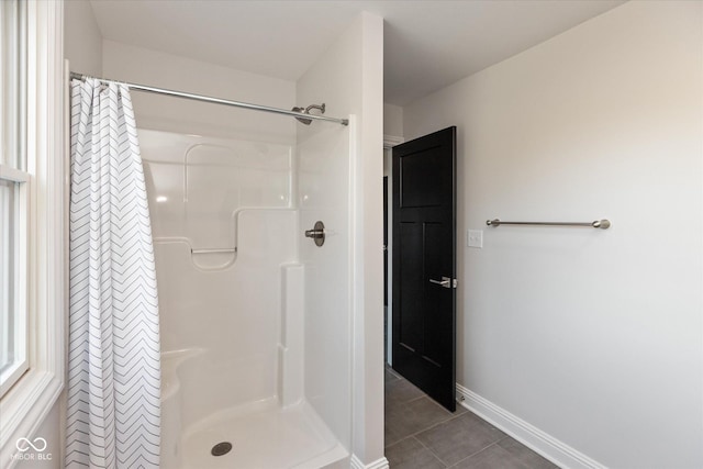 bathroom featuring tile patterned flooring and a shower with shower curtain