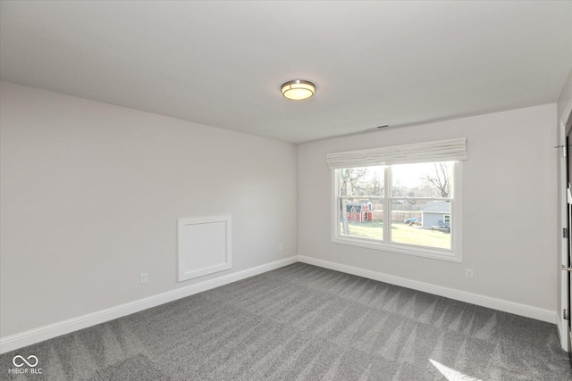 spare room featuring carpet floors