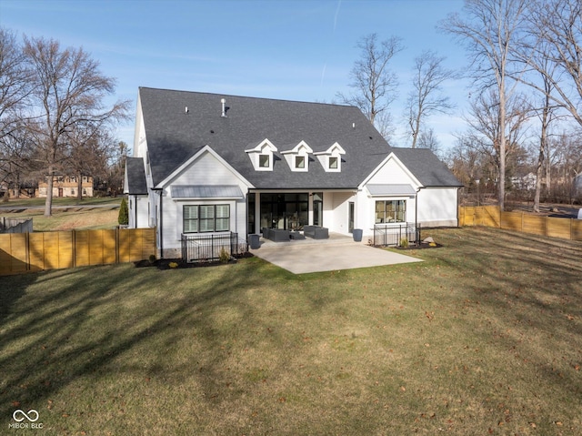 back of house featuring a yard and a patio