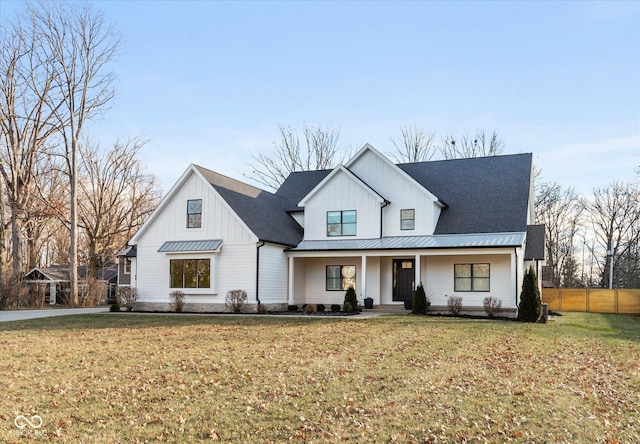 modern inspired farmhouse featuring a front lawn