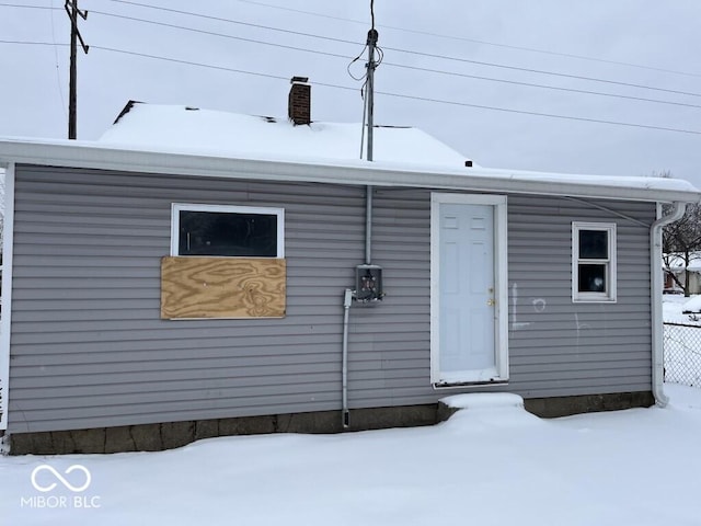 view of snow covered house